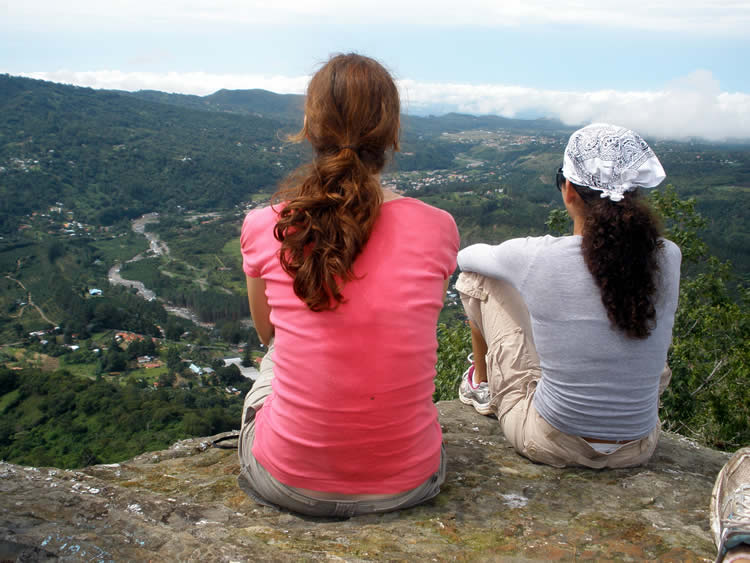 Girl Hikers enjoying a panoramic view of Boquete, Panama